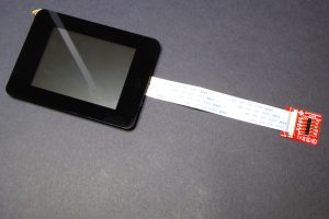 The gen4-uLCD-32DCT-CLB display with a nice bezel and the flat cable connected to the interface board